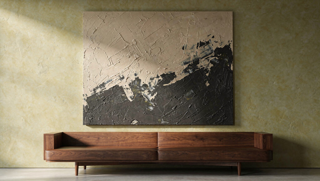 One oversized textured abstract canvas in oat and charcoal tones spanning about three-quarters of the low walnut sofa beneath it, on a warm limewash wall with generous empty space around it